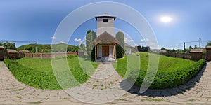 360 panorama of the Catholic chapel exterior in VÃÂ¡rmezÃâ CÃÂ¢mpu CetÃÆÃâºii / Burgfeld, Transylvania, Romania